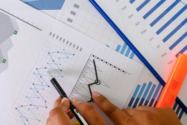 Pile of pages with graphs and charts.