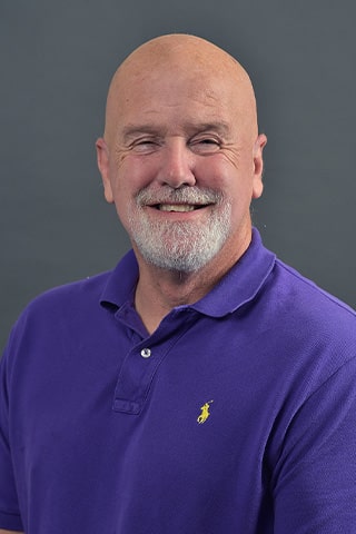 A professional headshot of Dr. Al Poling