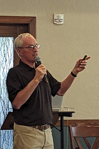 OLLI Professor Randy Schau giving a lesson on stories behind popular music.
