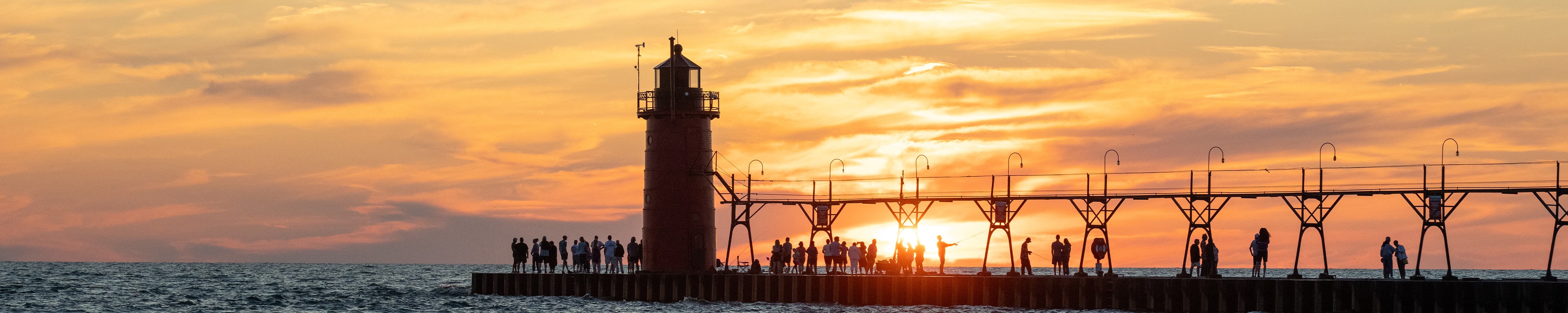 The South Haven pier at sunset in August.