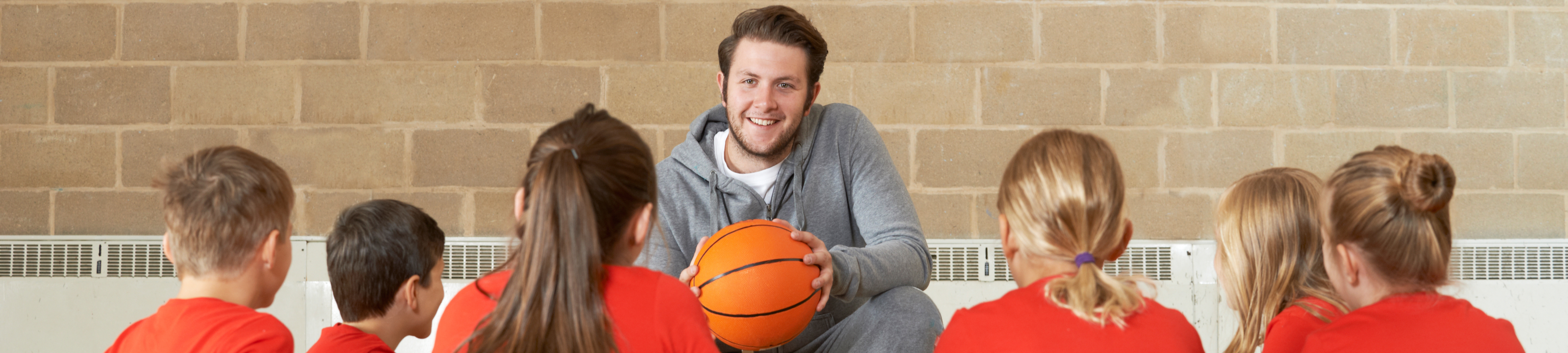 teacher and students in gym