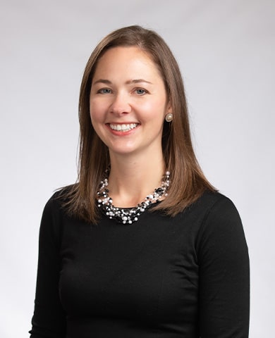 A professional headshot of Adrienne Fraaza