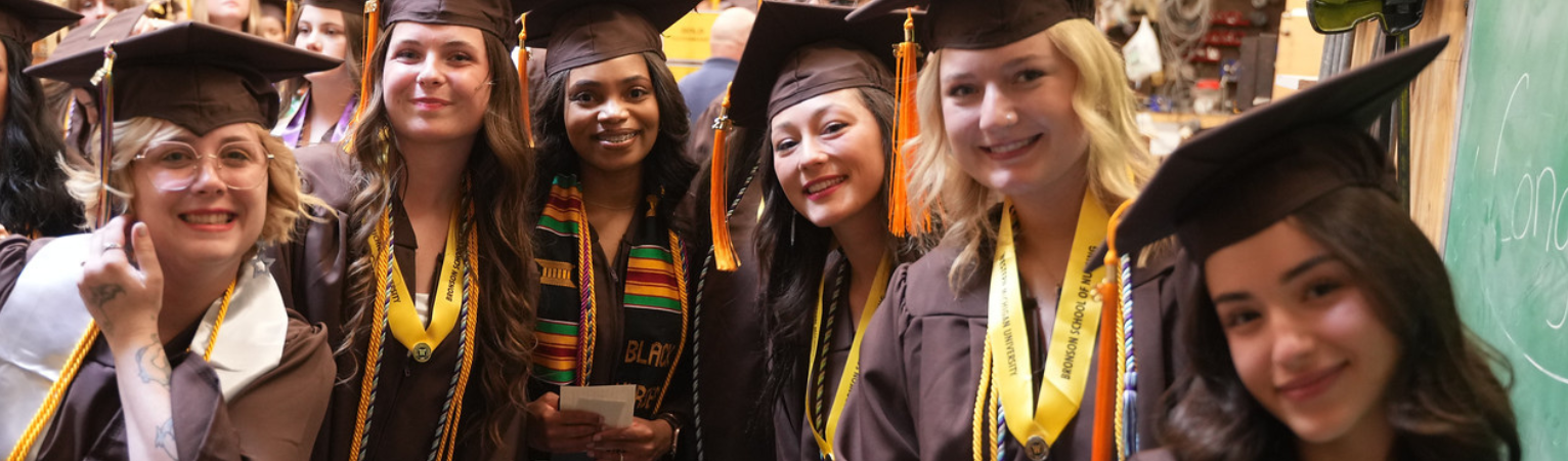 Image of five female nursing graduates