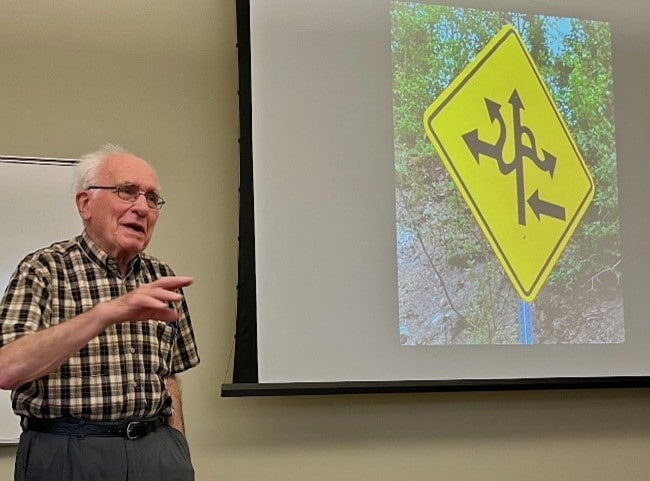 Dr. John Geisler teaching a course on the odd signs of the world. 
