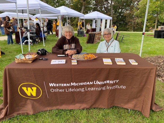 OLLI Leadership Team Members Hosting Table at WMU's 2025 Homecoming Tailgate