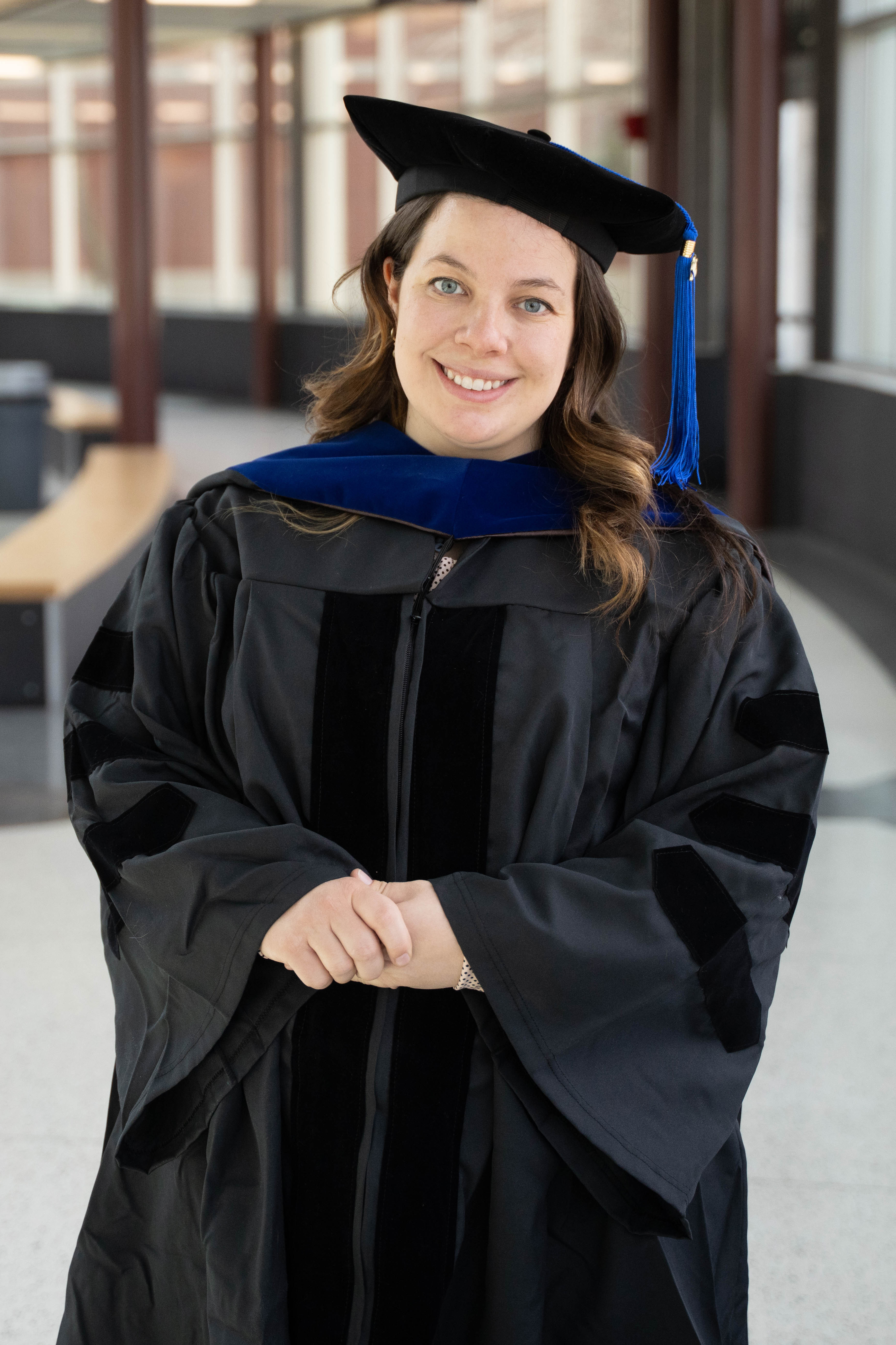 Dr. Margaret Mooney in hooding garb