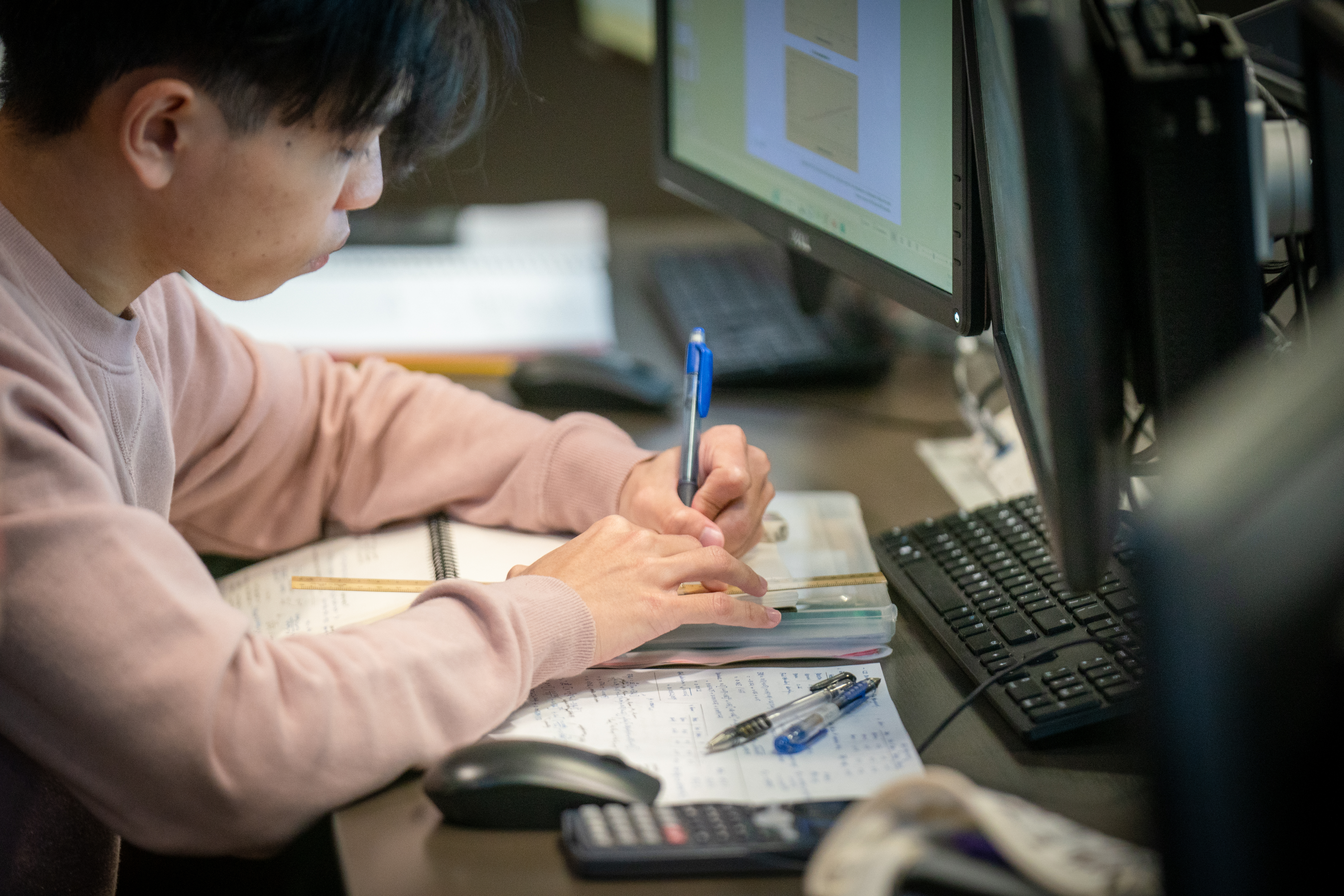 a business student using a computer in class