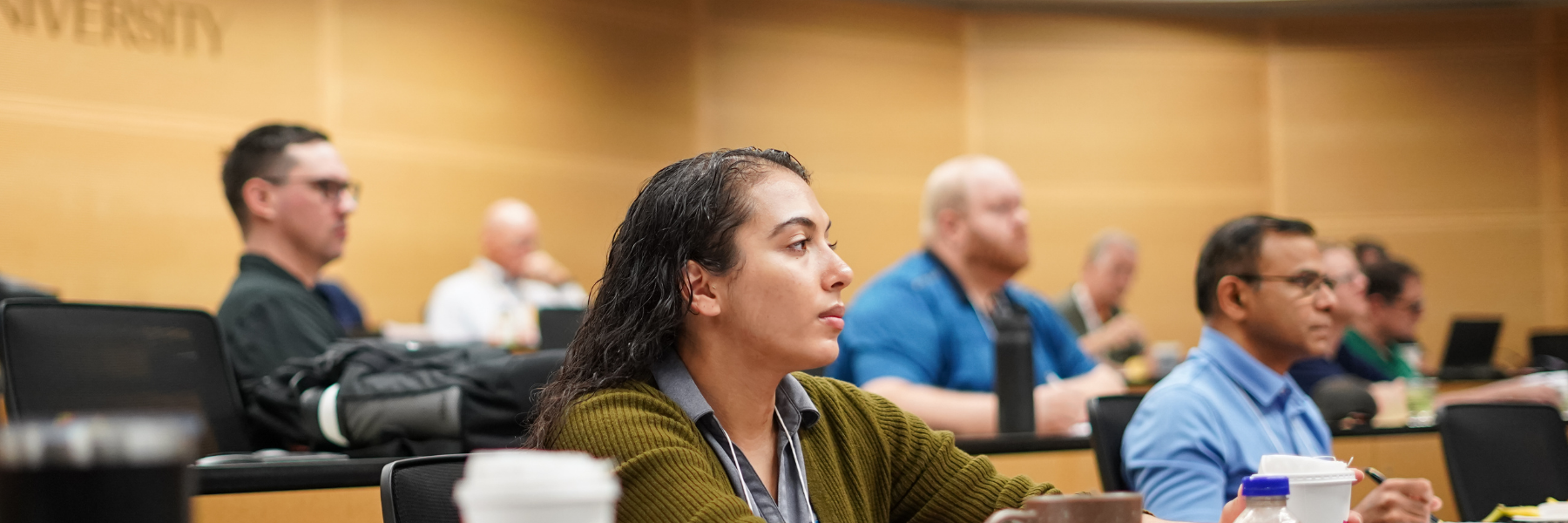 adults in a lecture hall setting
