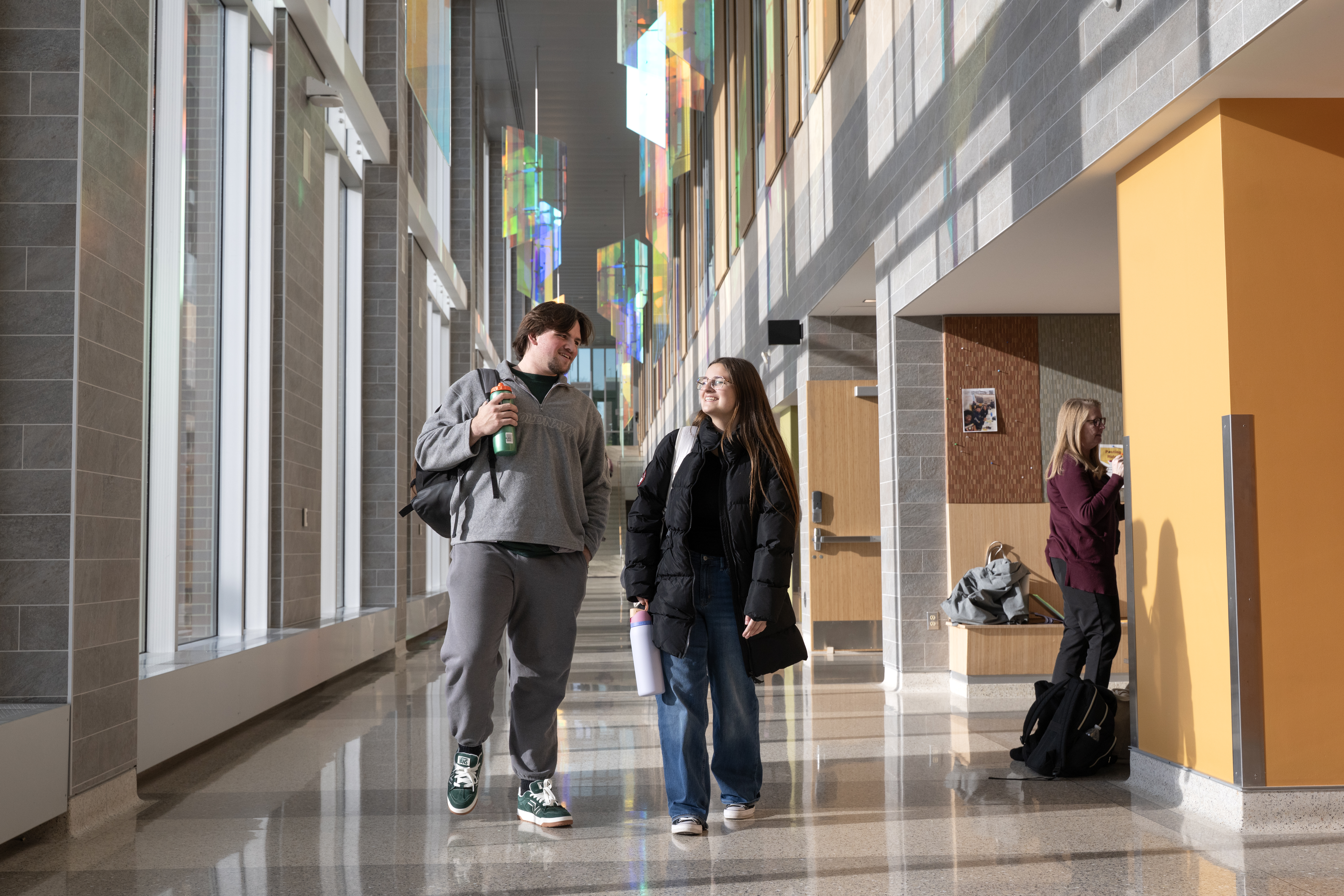 Two students walking in Sangren Hall