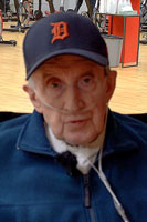 An 84 year old man named Woody Top sitting in a wheelchair