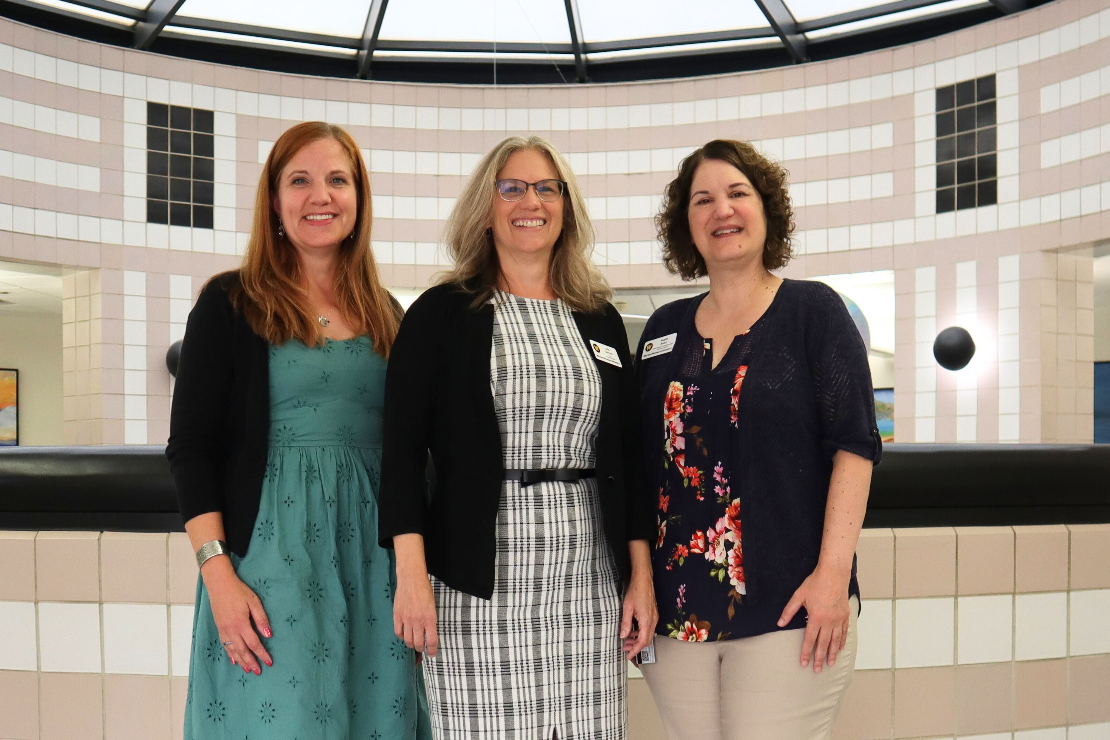 KARE award recipients Megan Brown (left) and Angela Brcka (right) with Dean Julie Garrison (center). 