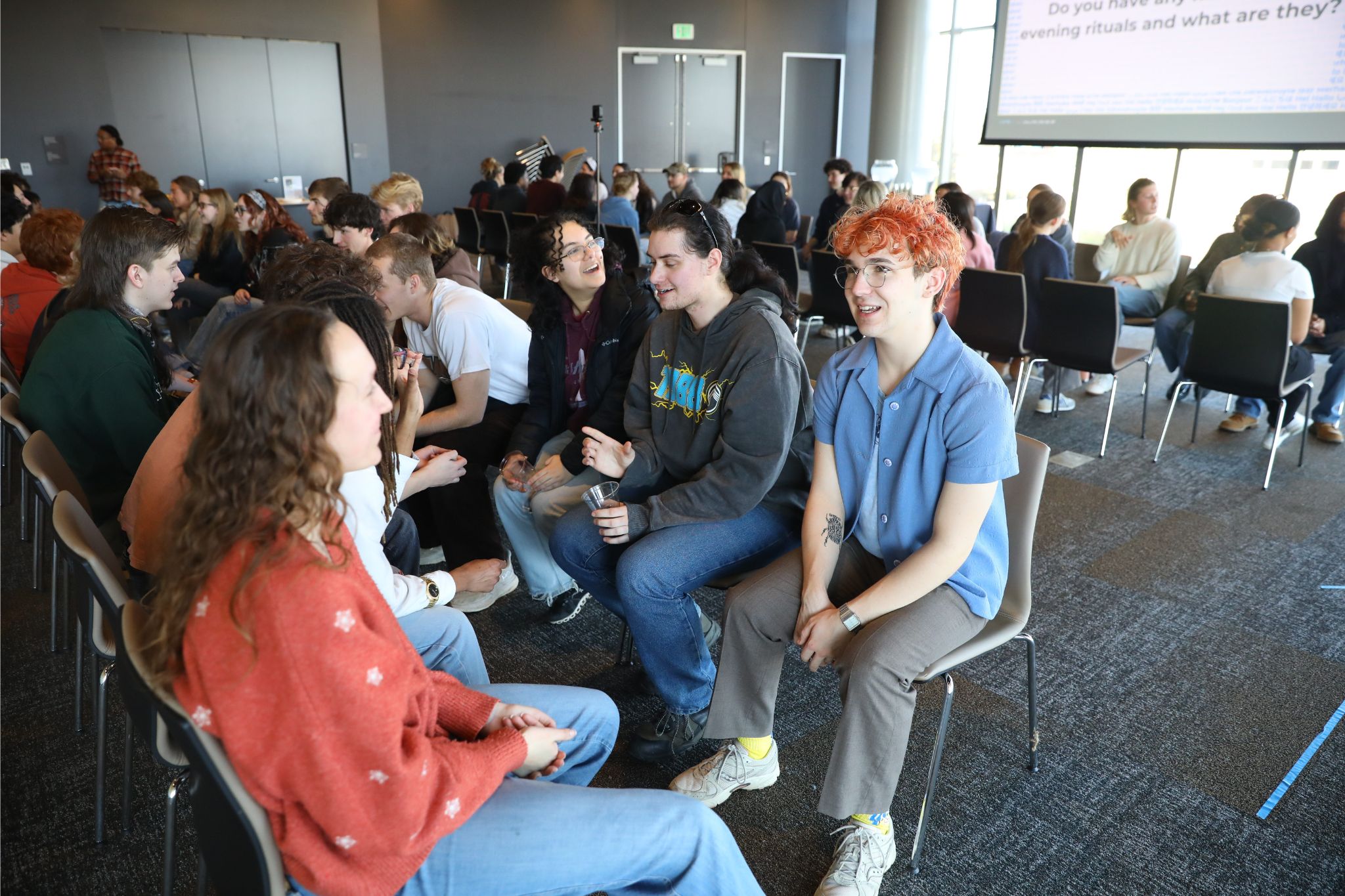 Students face each other and talk about their cultures in the Student Center during Mini Cultural Festival