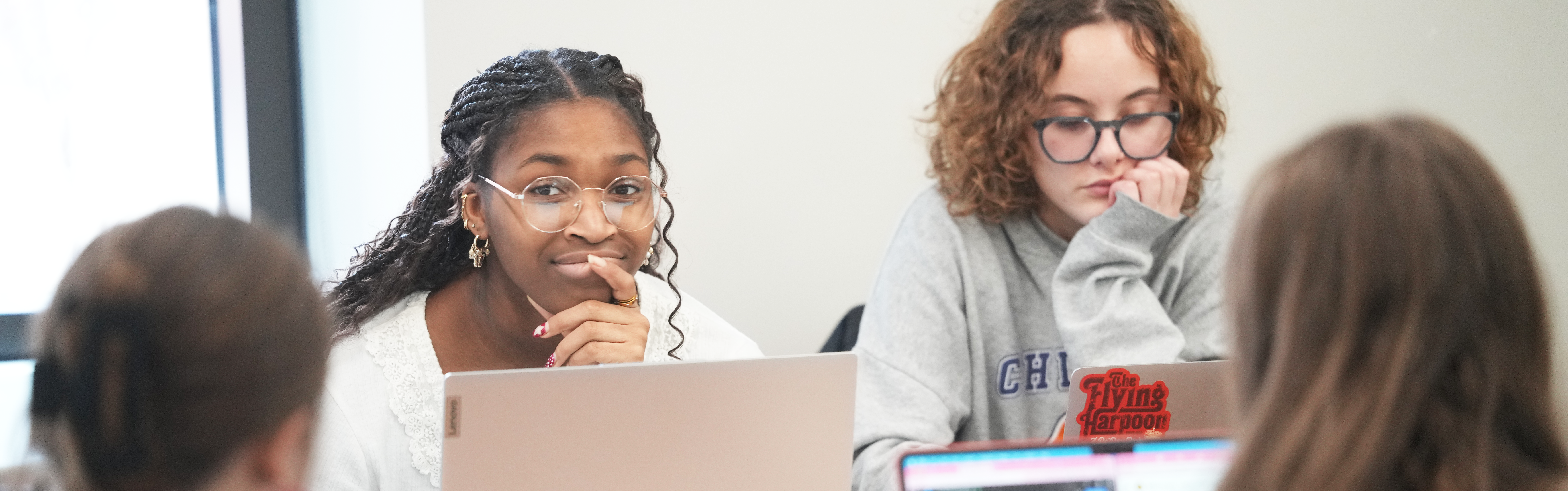 A group of students in conversation.