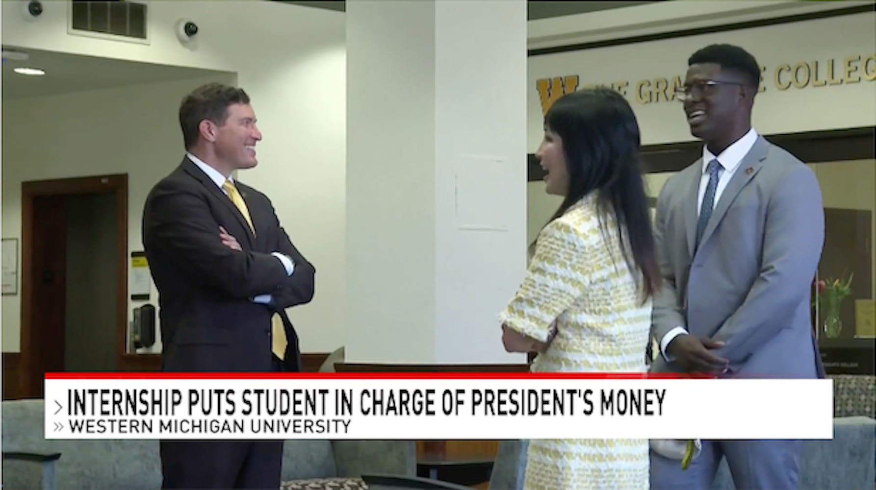 President Kavalhuna, standing, talks about the Zhang Financial Presidential Internship