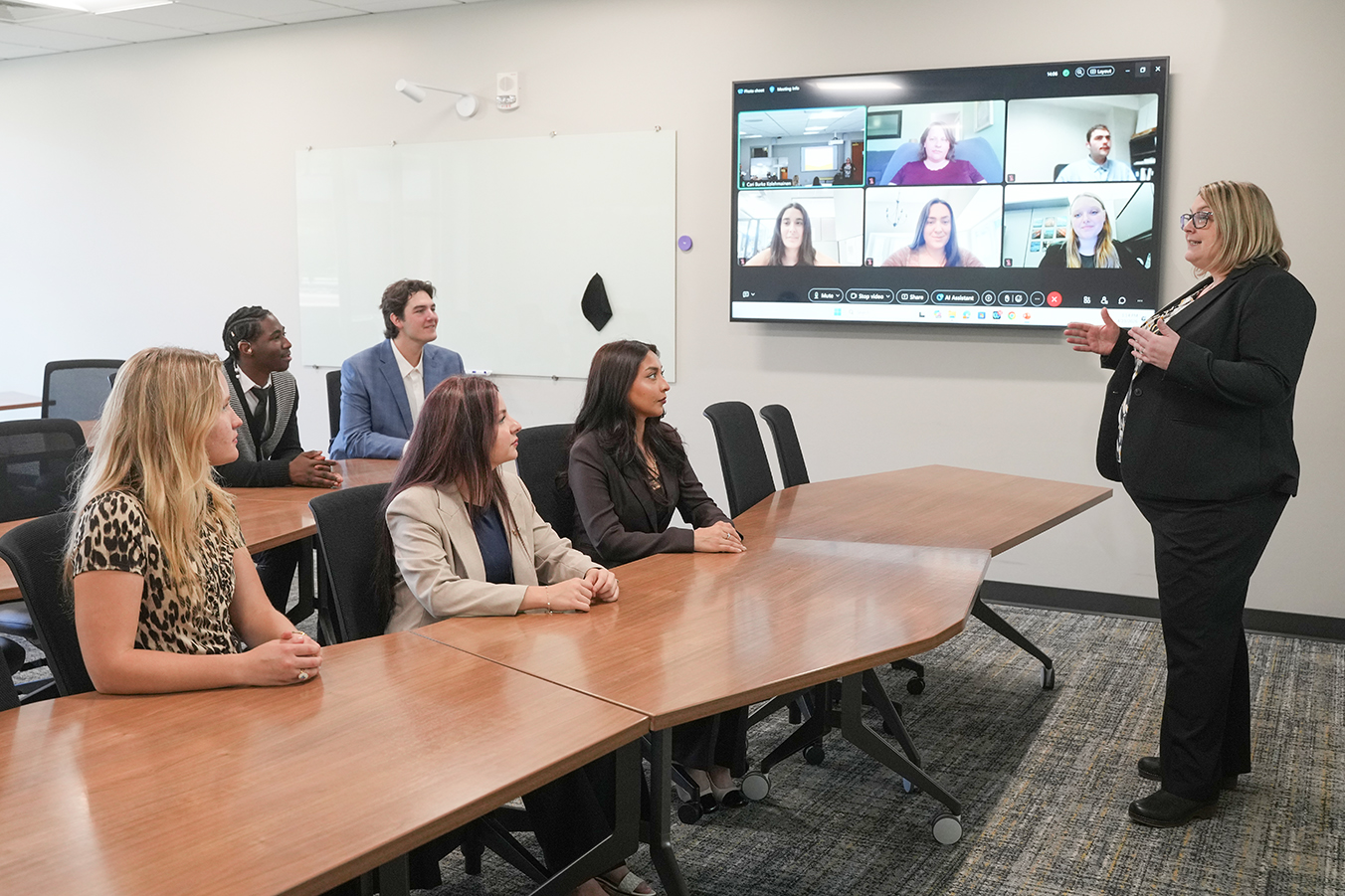 A high-flex classroom with a professor and students in-person and online