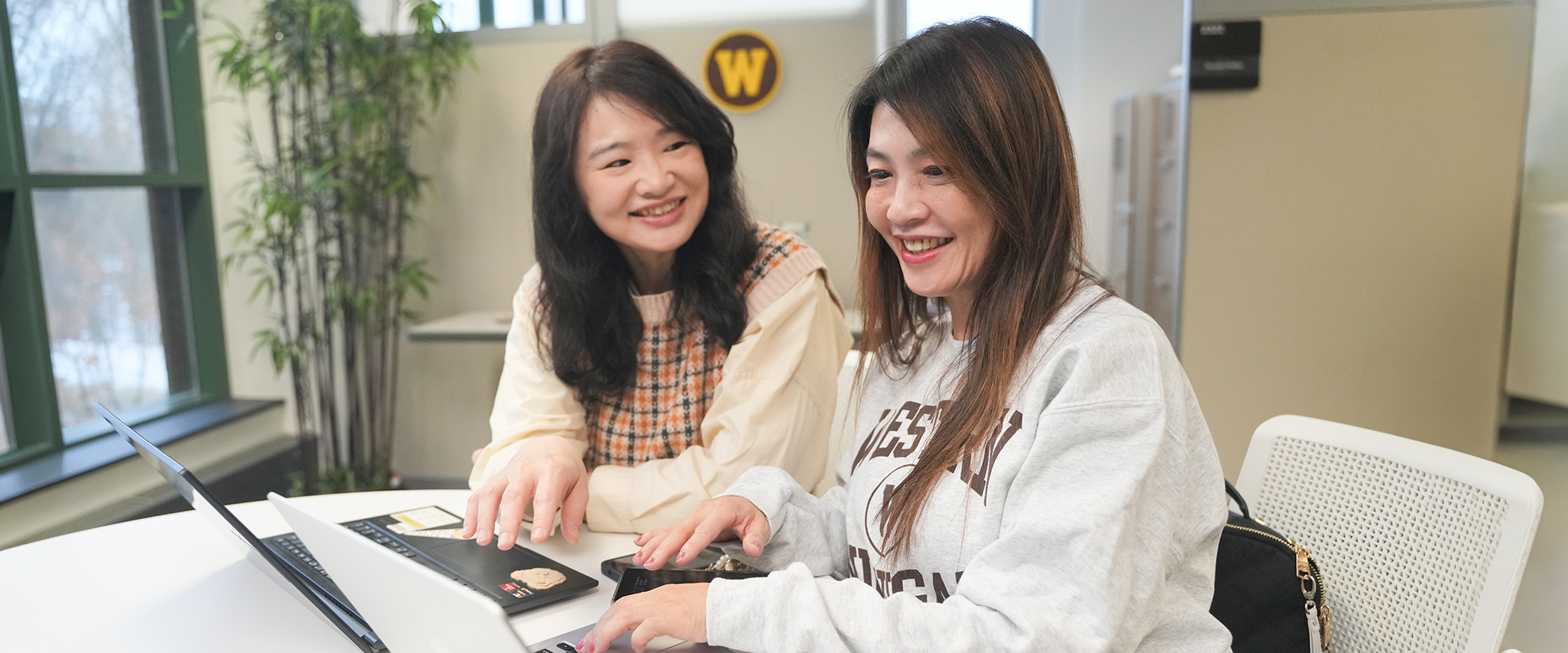 Two students sitting at a table