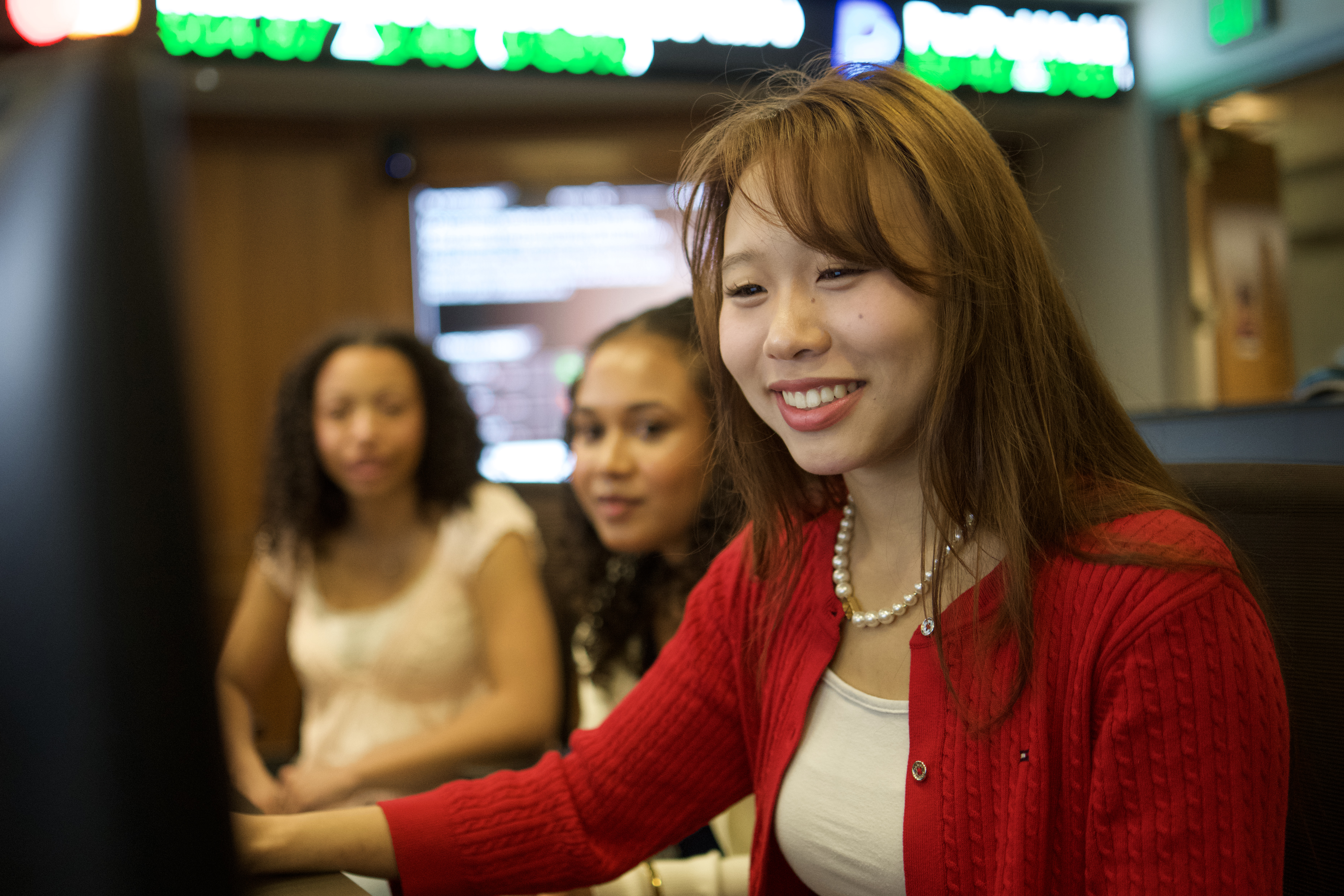 A woman in the Greenleaf Trading Room looking at her computer