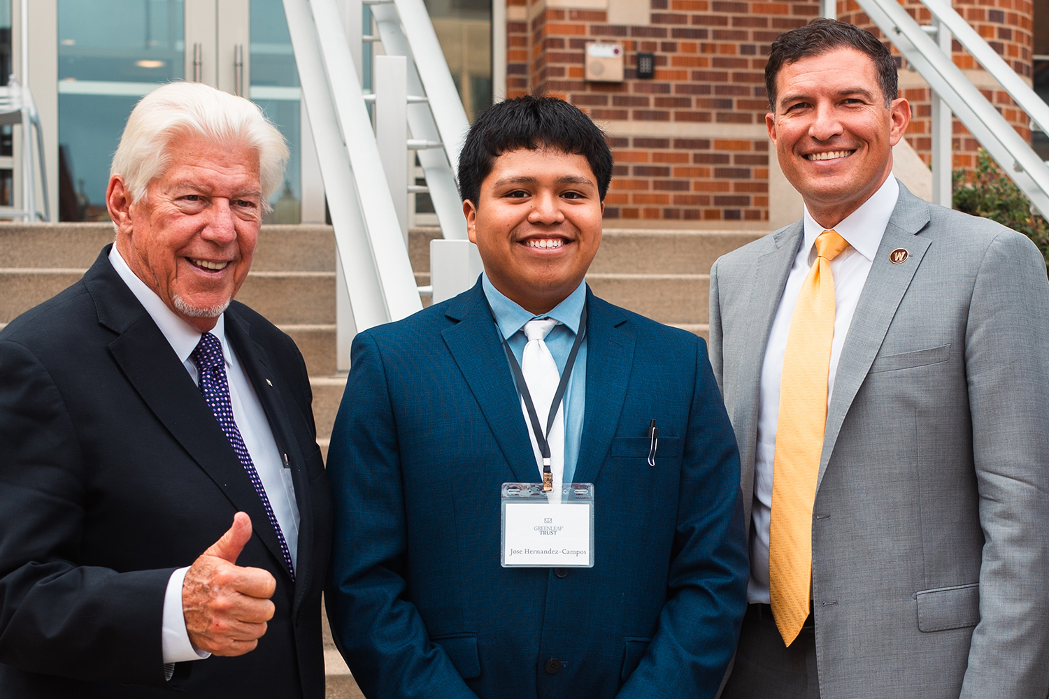 Scholarship donor and recipient with WMU President Russel Kavalhuna