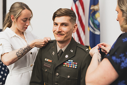 An ROTC cadet receiving their rank pin
