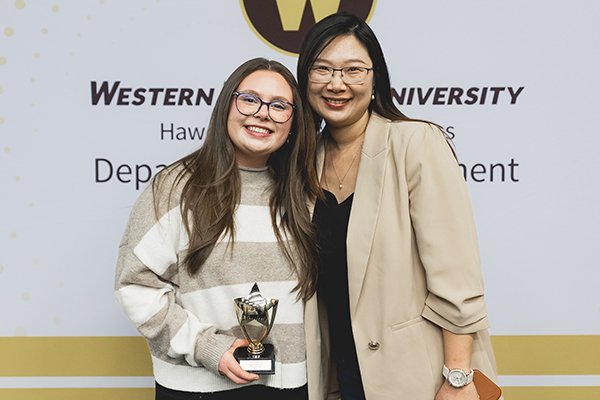 A student and her professor after receiving a scholarship