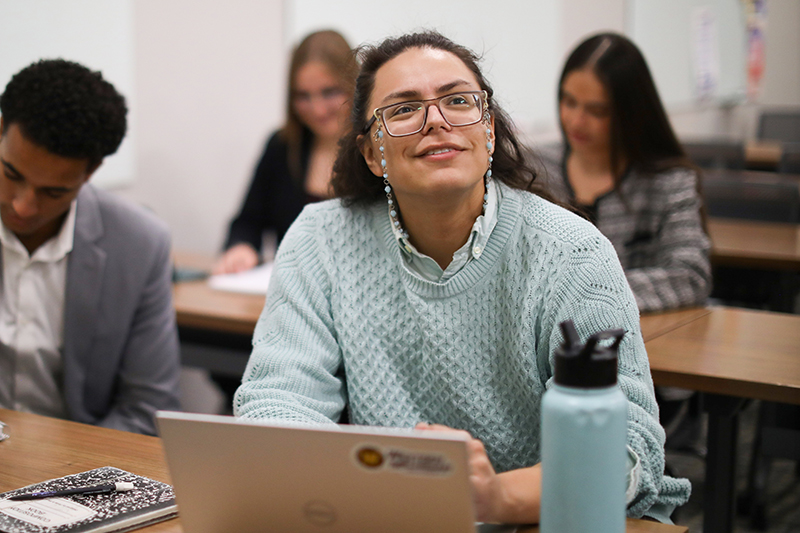 A student sitting and asking questions