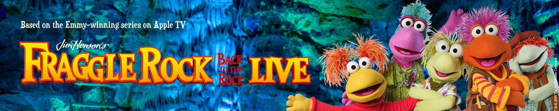 Colorful puppets under the Logo Fraggle Rock on a blue and green rock background