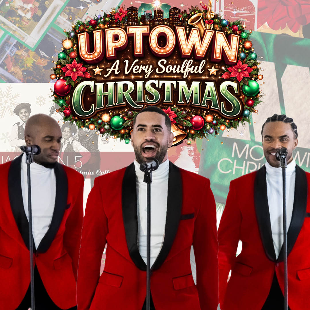 Three men in red suits standing in front of microphones singing with the Uptown show logo placed behind them.