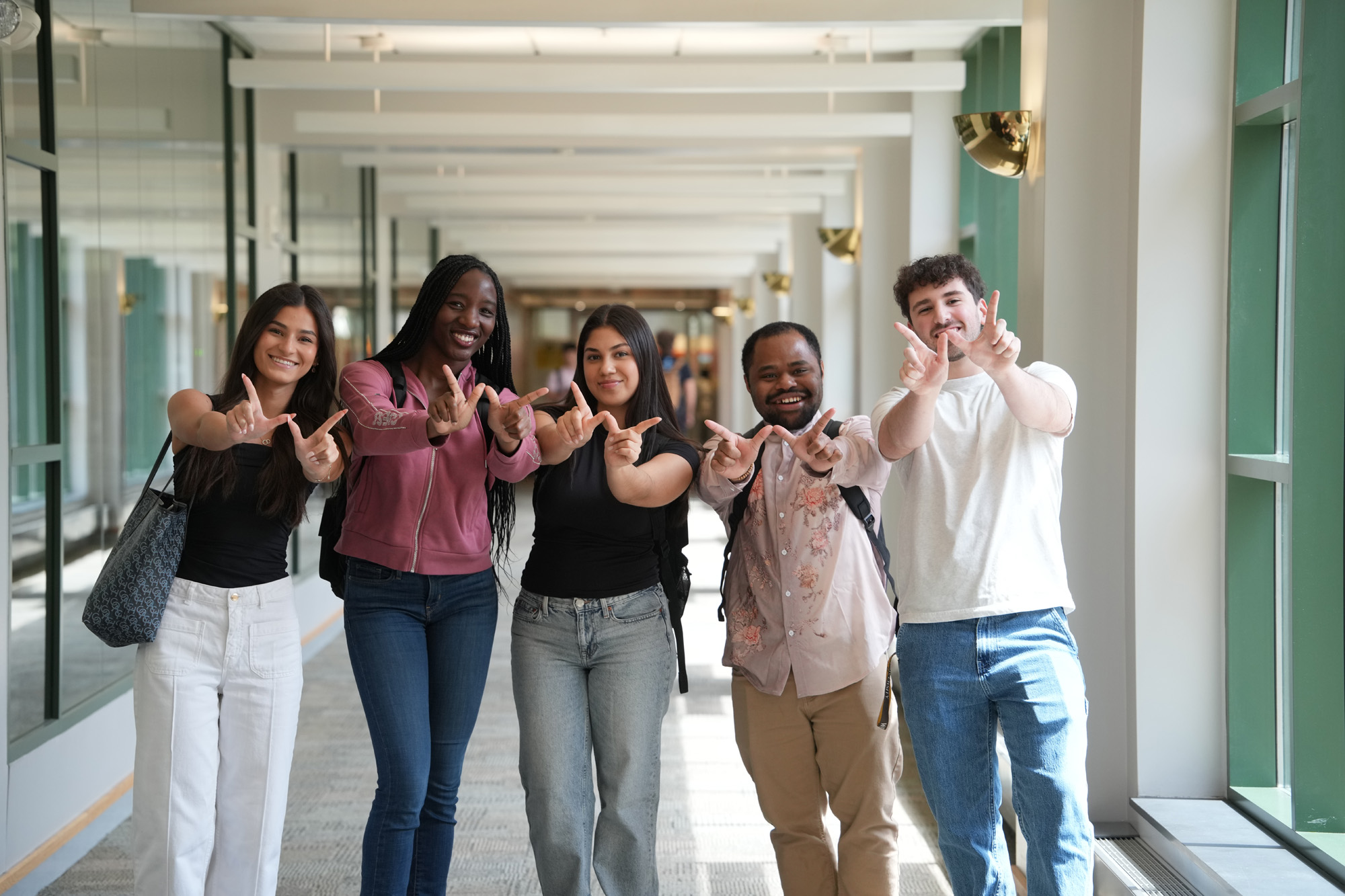 MBA students in the hallway of Schneider Hall