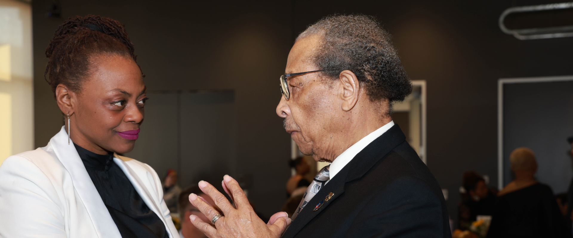 Dr. Lewis Walker speaking with Dr. Yolanda Sealy-Ruiz at LWI Gala