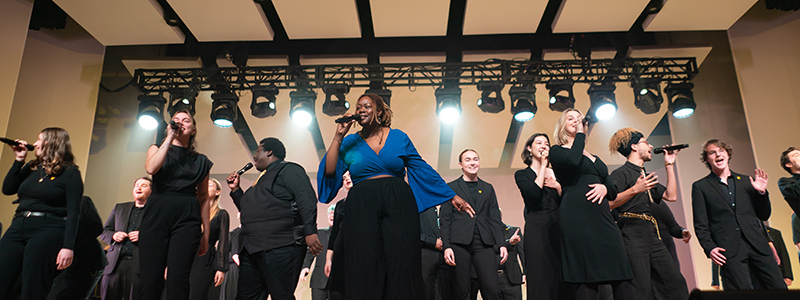 Gold Company vocal jazz group performing on the Dalton Center stage.