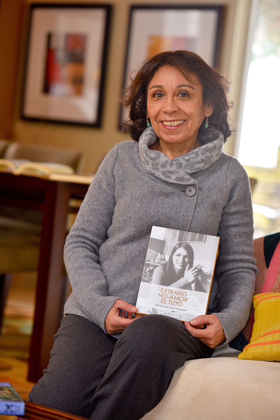 Dr. Lopez holding her latest book. 