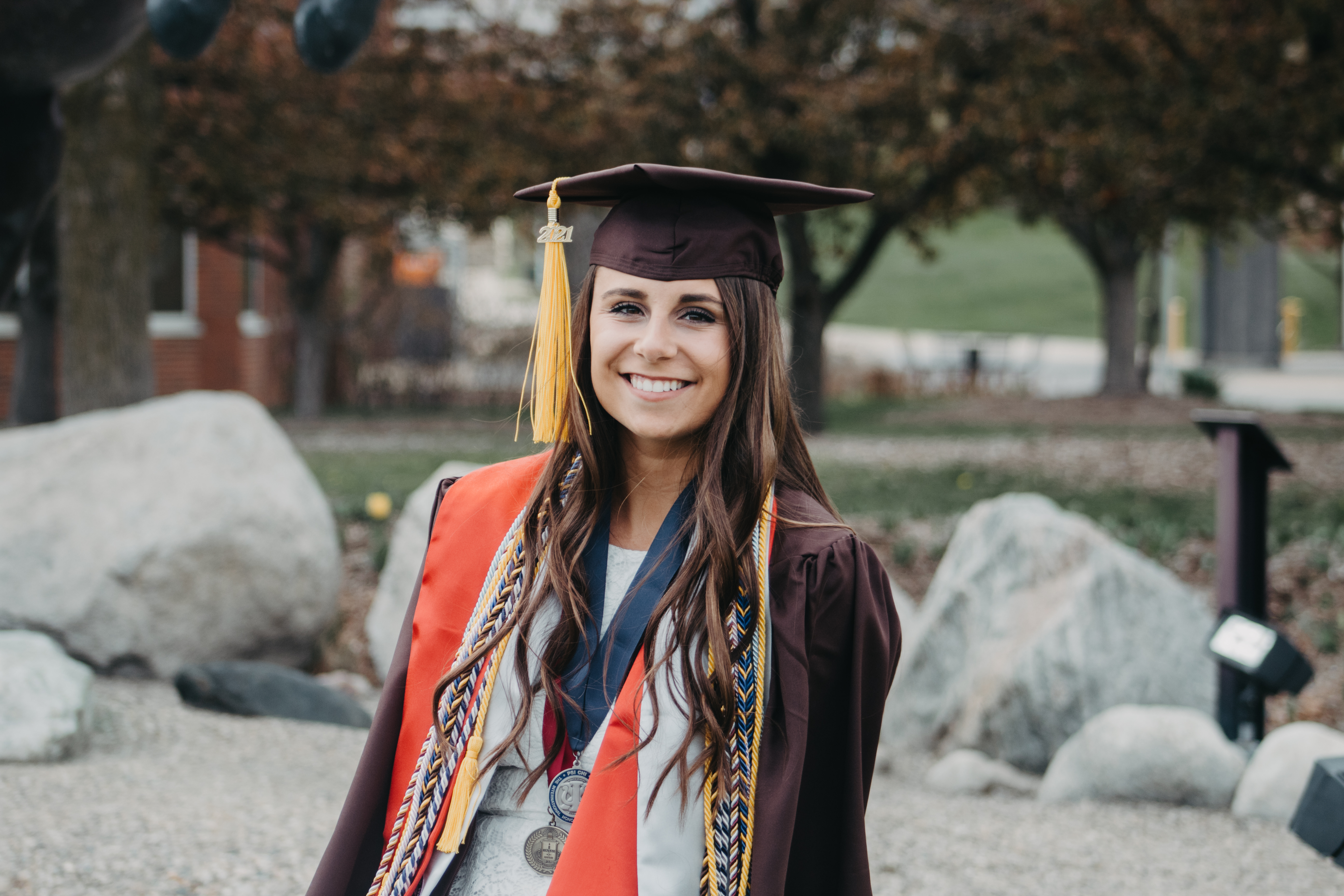Photo of Sadie Martin in her graduation regalia. 