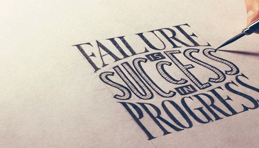 Caligraphy reading "Failure is success in progress."