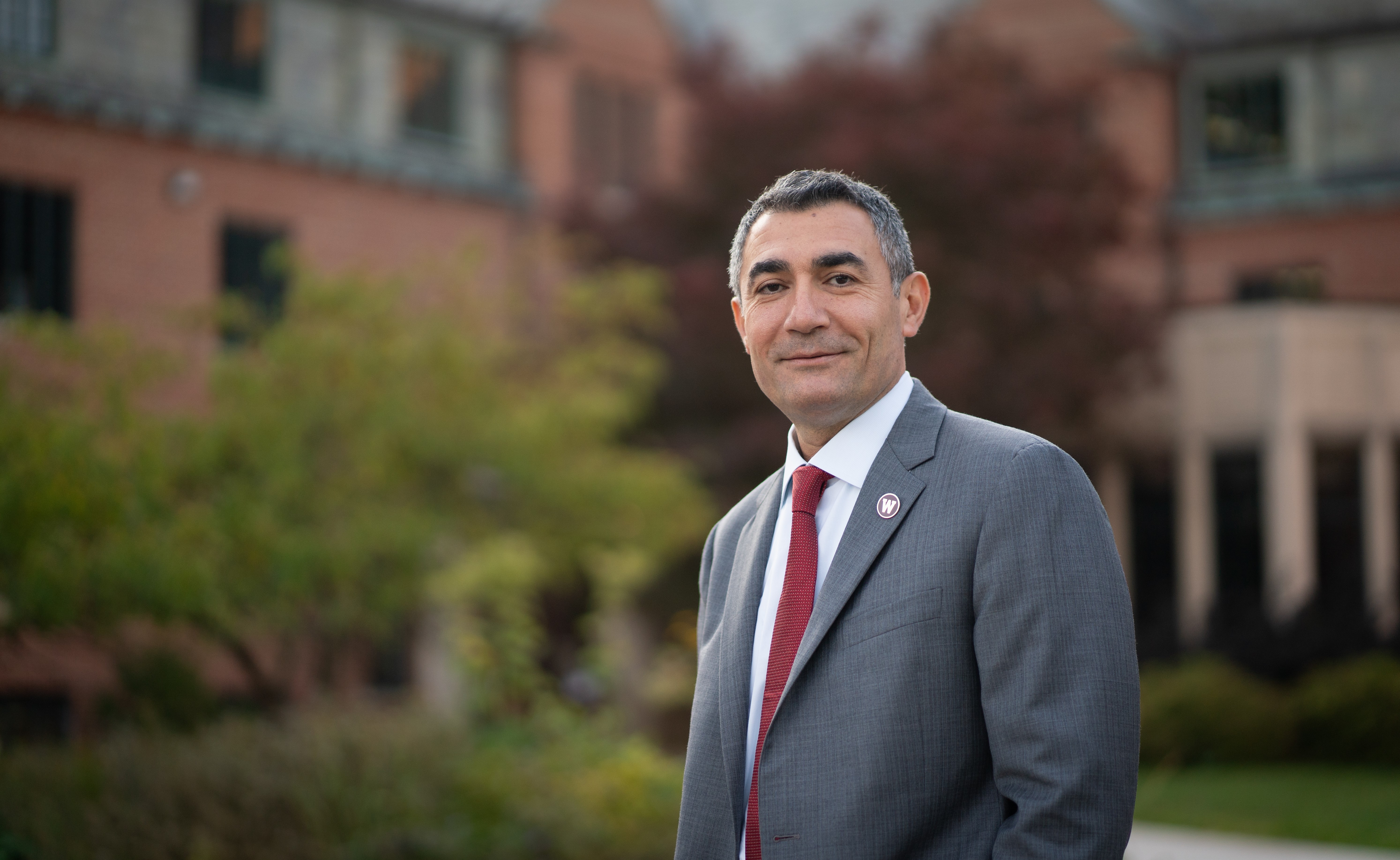 Dr. Remzi Seker standing outside for a portrait.