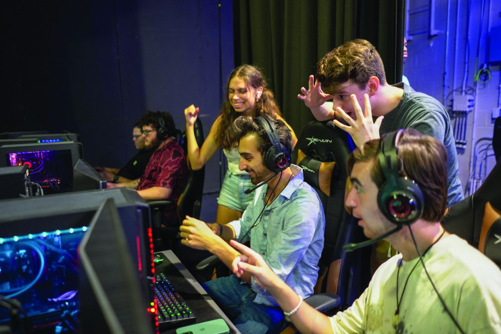 Students playing esports in the theatre.