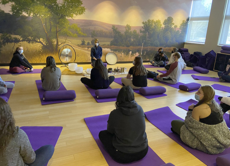 Students practicing yoga at the WMU College of Health and Human Services
