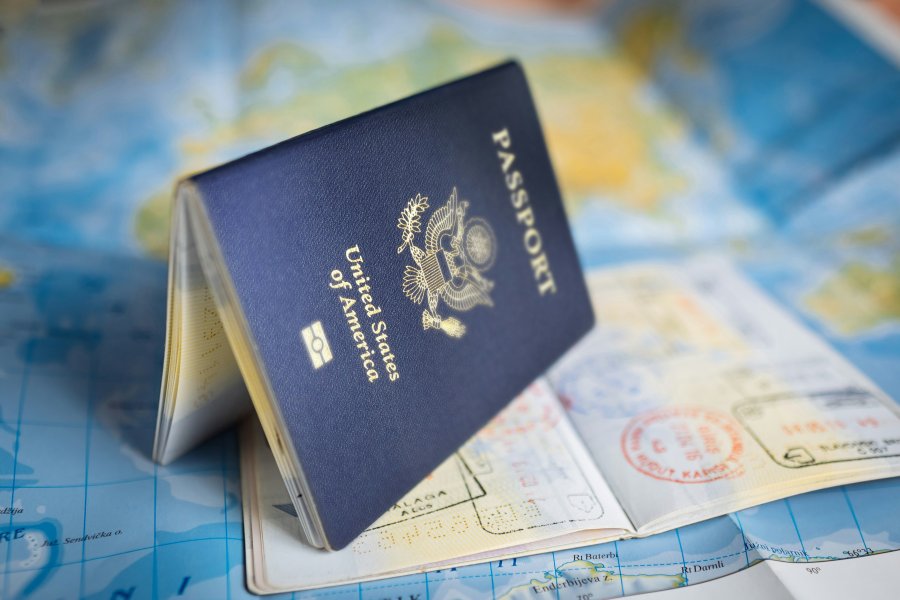 U.S. Passport over a map.