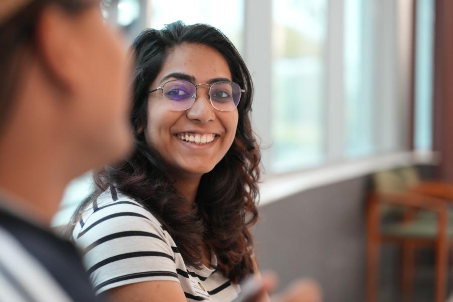 Woman in classroom smiling