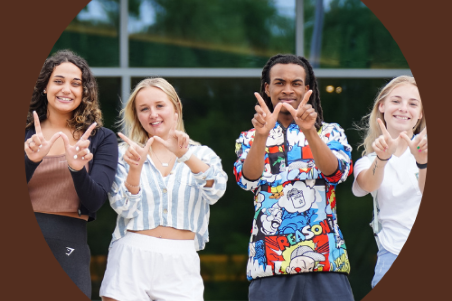 Students making the Western W on campus