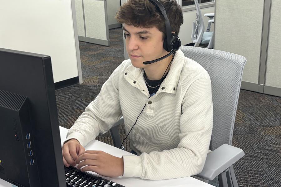Jose Ortiz-Martinez working at the Technology Help Desk in the University Computing Center