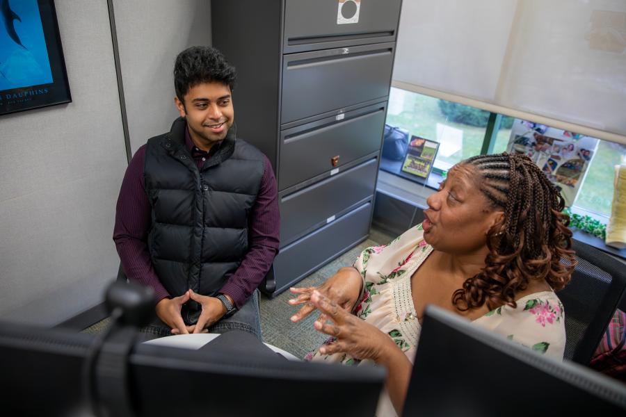 A student talking with an academic advisor