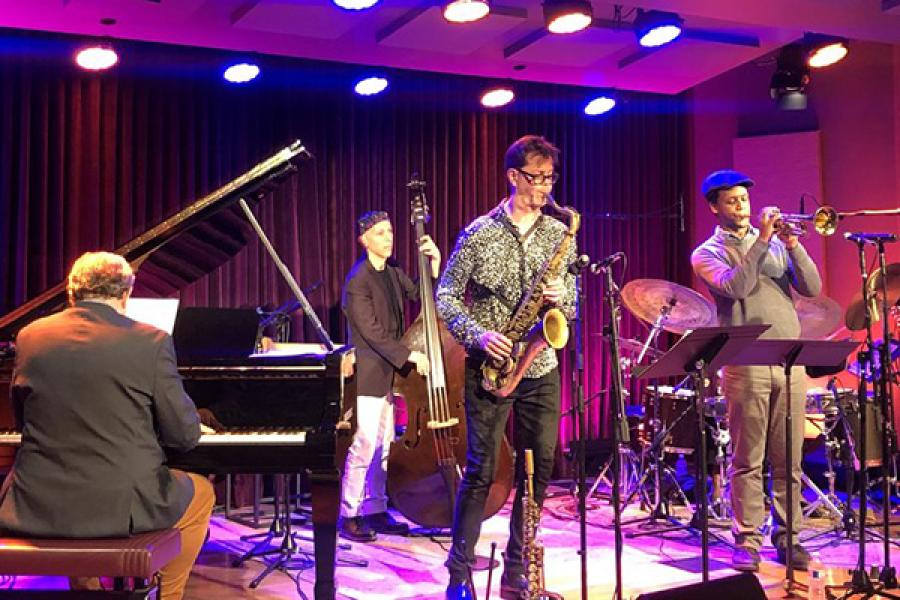 A jazz ensemble performs on stage.