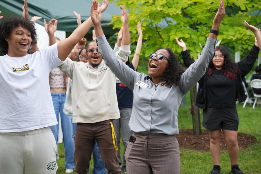 Dr. Luchara Wallace dances with students at the multicultural cookout.