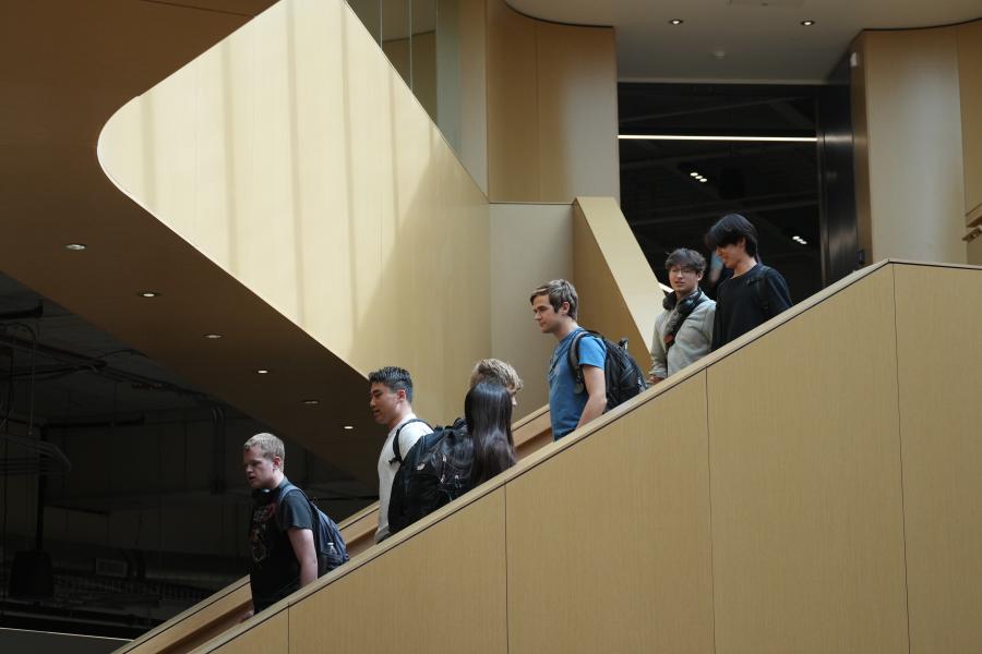Students walk down the gathering stairs