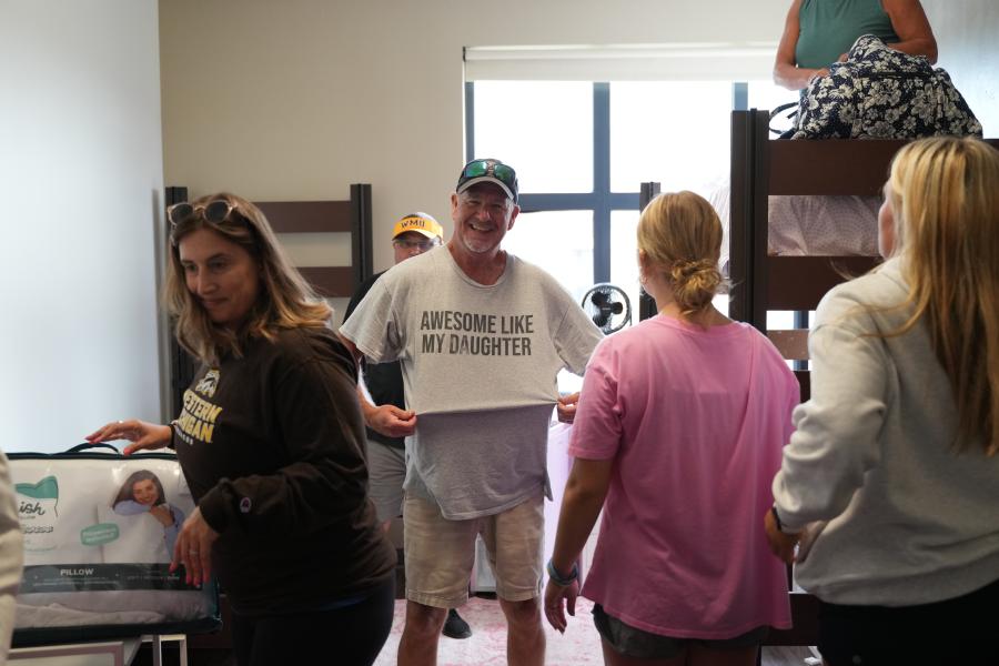 A family moves into a residence hall.