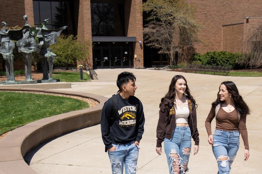 Students wearing Bronco gear on campus.
