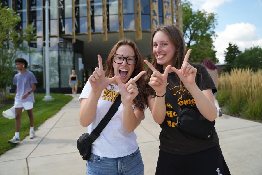 Students pose outside the Student Center