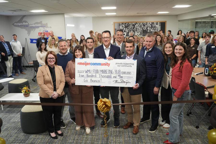 A group photo with a $500,000 check.