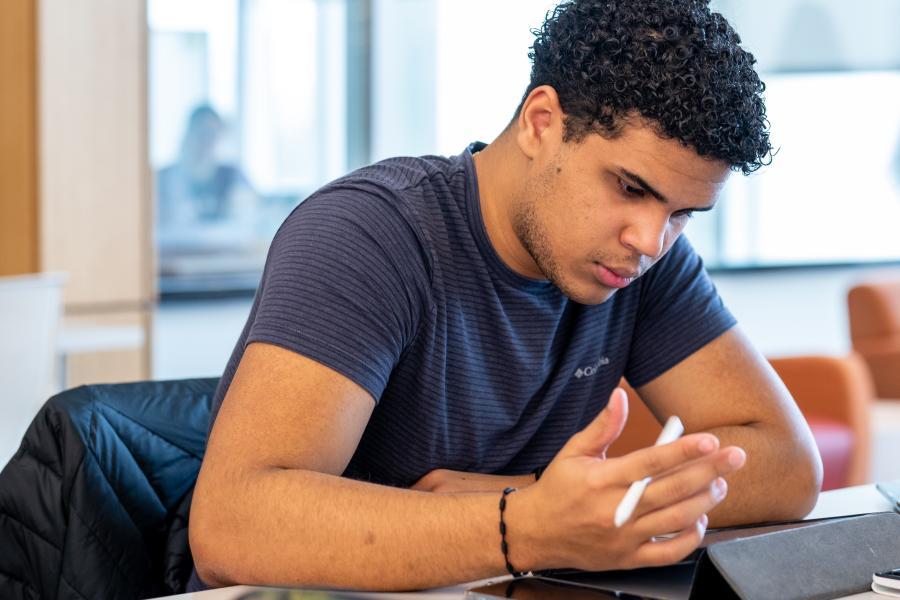 A student studying at a table