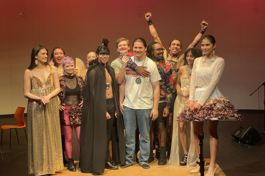 Members of the Native American Student Organization stand together on stage.